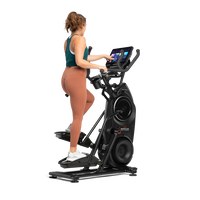 A woman exercising on a BowFlex Max Trainer 40.--thumbnail