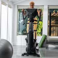 A woman working out on a BowFlex Max Trainer 40.--thumbnail