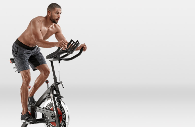 Man riding a Schwinn IC3 indoor cycling bike